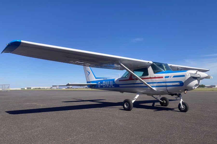 Cessna 152 G-BNUL parked on the grass